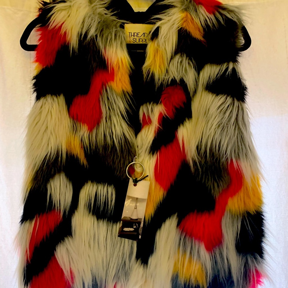 Label thread and supply. Funky multi colored fur vest. Zipper front. Black band